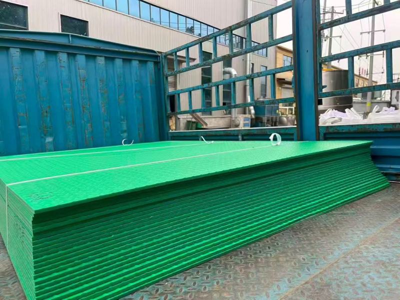 Green HDPE mats in the factory yard